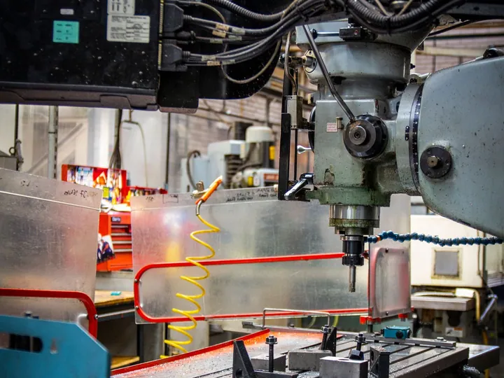 Close view of an industrial lathe in a machine shop