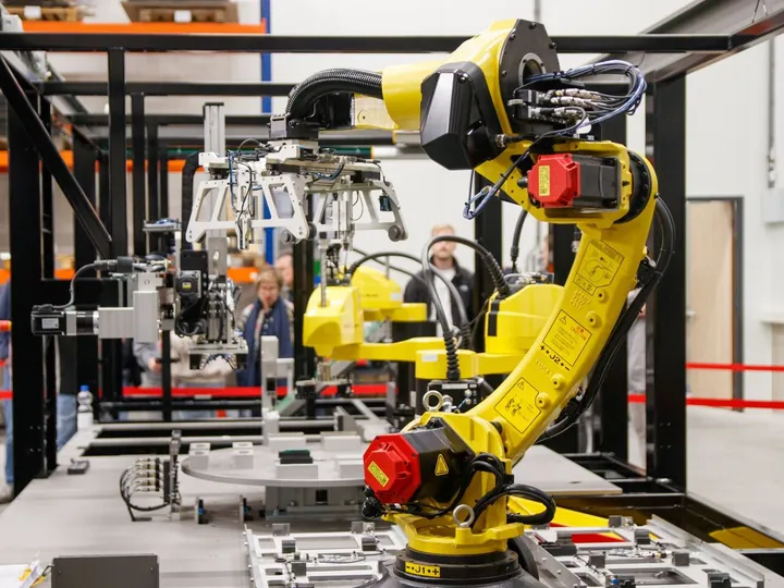 Industrial robotic arm inside a manufacturing facility